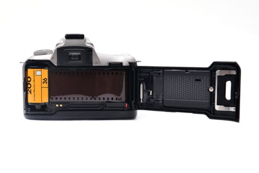 camera with 35 mm film on white background