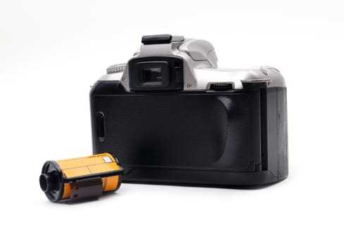 camera with 35 mm film on white background