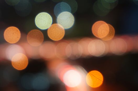 Night lights bokeh of a wide variety of colors including red, green, yellow, blue, orange and white.                                