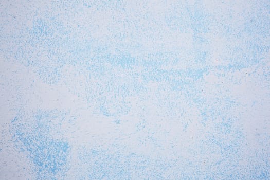 abstract pattern of blue paint on wall