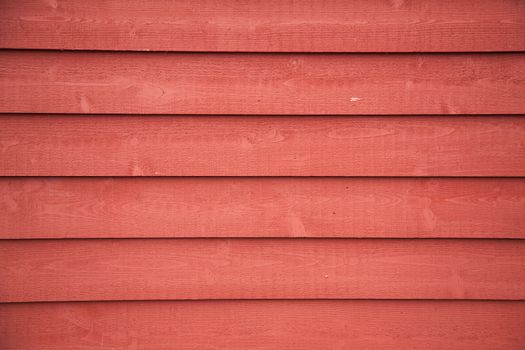 horizontal picture of  horizontal planks with bright red paint