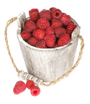 Fresh raspberry in the wooden bucket