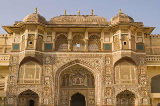 Ornately decorated gateway (Ganesh Pol) inside Amber Palace, Jaipur, Rajasthan, India