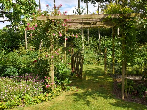 Beautiful gardening project - creative garden tunnel archway in a classical garden