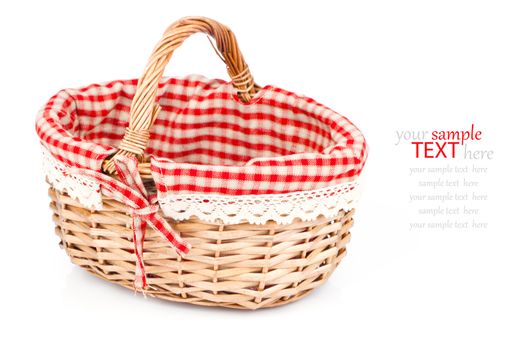 Empty wicker basket with red linen lining, isolated on white background