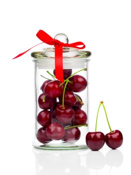 fresh Sweet cherry in glass jar, isolated on white