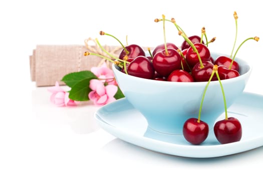 Bowl full of cherries isolated on white background