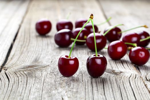 fresh cherries on old wooden table