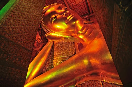 The face of Reclining Buddha statue in Thailand Buddha Temple Wat PO