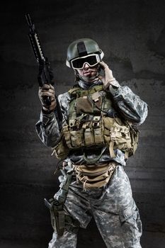 American Soldier wearing a mask and talking via radio