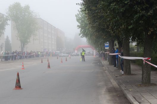 slalom trail marked with orange towers in the thick fog