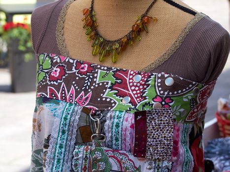 Colorful blouse top on a Mannequin display in a women fashion shop