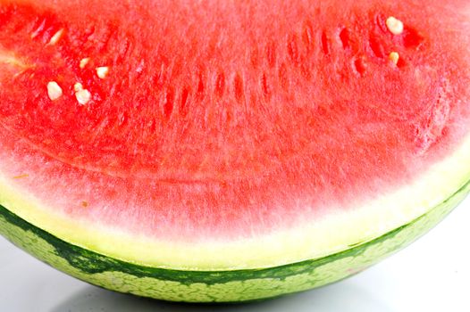 A fresh slice of watermelon on a white background