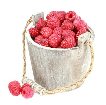 Fresh raspberry in the wooden bucket