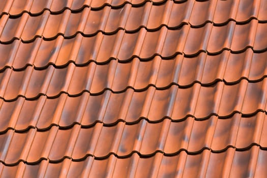 Red tiles roof background texture of a house