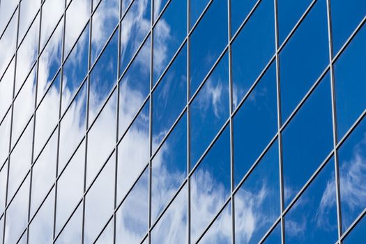 perfect texture of blue glass high-rise corporate buildings and industrial skyscrapers in business office center