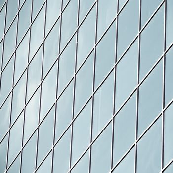 perfect texture of blue glass high-rise corporate buildings and industrial skyscrapers in business office center