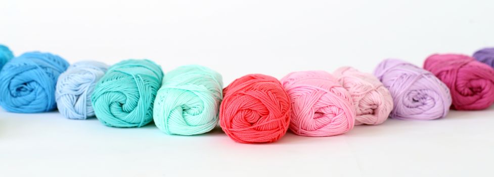 Colorful threads on a white background