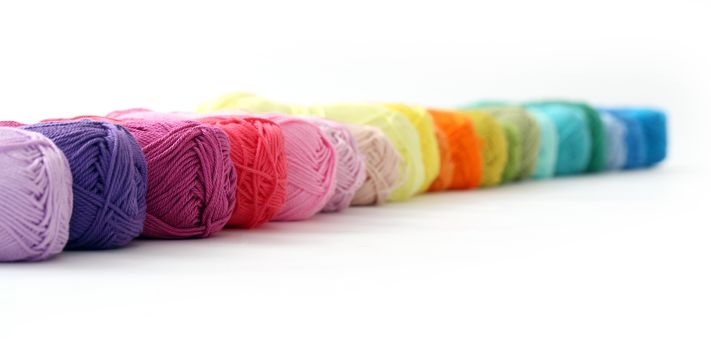 Colorful threads on a white background