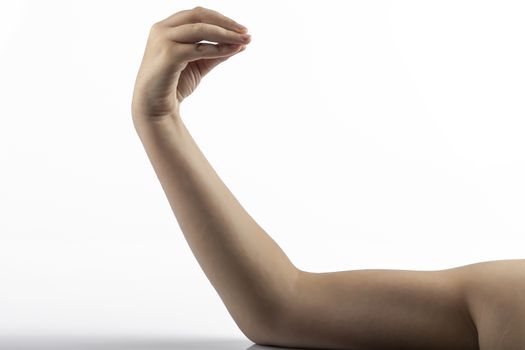 Young hands make a Italian Finger purse gesture