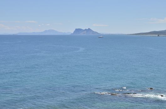 The Strait of Gibraltar  is a narrow strait that connects the Atlantic Ocean to the Mediterranean Sea and separates Gibraltar and Spain in Europe from Morocco in Africa. 