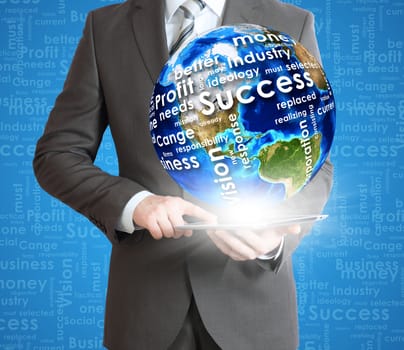 Businessman holds tablet pc with Earth in hand. On the globe written business words. Elements of this image are furnished by NASA