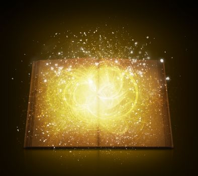 Old open book with magic light and falling stars. Dark background