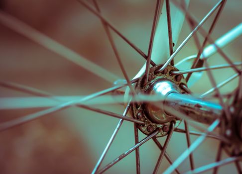 Grunge style retro artistic style close-up on a bicycle front wheel, great  background or texture