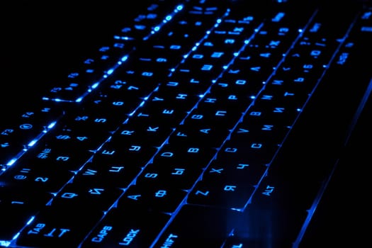 Blue lighting keyboard in the dark