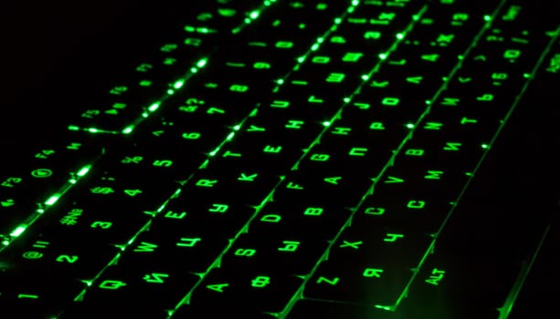 Green lighting keyboard in the dark