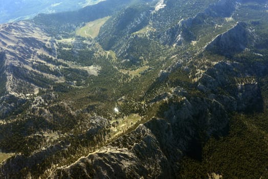 Mountains covered with trees. Top view. Natural landscape