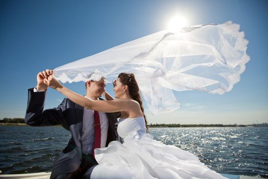 happy young couple on the yacht