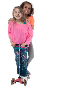 Cute little girls with skate scooter