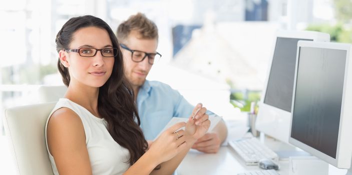 Team of designers at their desk in creative office