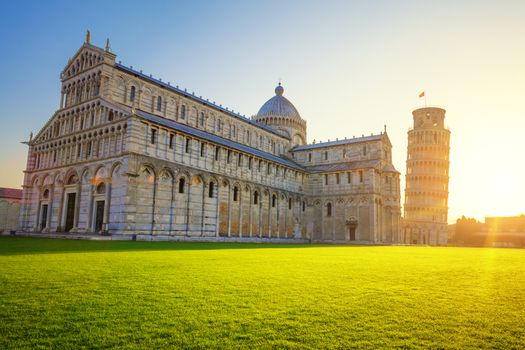 Pisa leaning tower and cathedral at sunrise, Italy. 