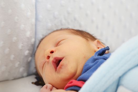 Newborn yawing. Focus in the mouth