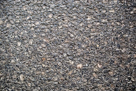 Black asphalt texture, useful as background for design works