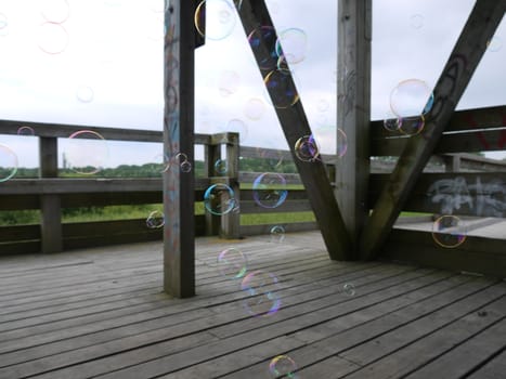 Soap bubble in the wooden tower near the sea side