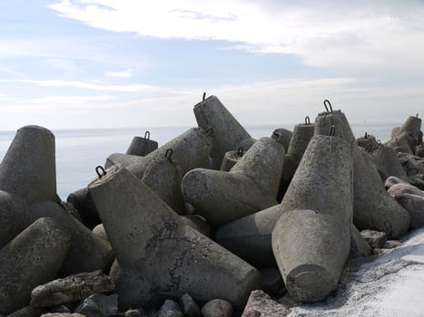 Concrete stones on Latvian dike by the Baltic sea