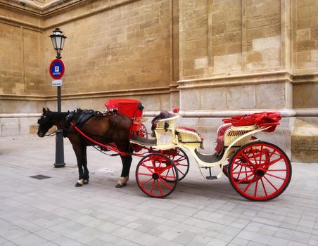 Red Cart with brown horse in Spain, Mallorca.