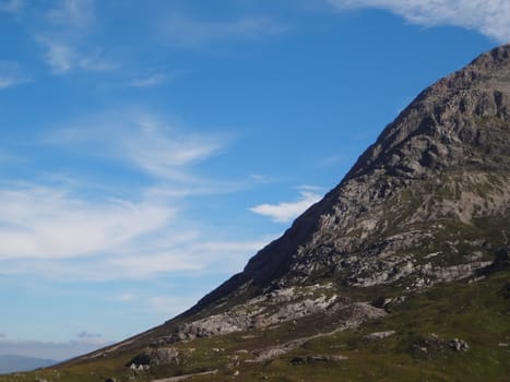 Scottish Highlands, mountain valley with blue sky