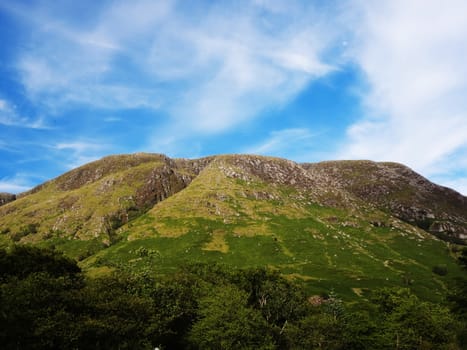 Scottish Highlands, mountain valley with blue sky