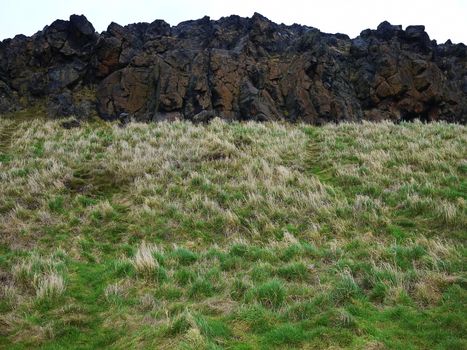 Two levels of grass and stone, sky