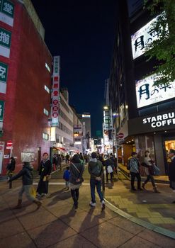 TOKYO, JAPAN - NOVEMBER 23, 2013 : Street life in Shinjuku November 23 2013. Shinjuku is a special ward located in Tokyo Metropolis, Japan. It is a major commercial and administrative centre 