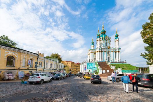 KIEV, UKRAINE - SEP 17, 2013: Saint Andrew orthodox churc and Andrew's descent is the major tourist attraction. It is area of many souvenir shops and art galleries.