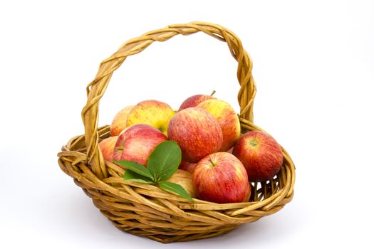 fresh apples in a basket on white background