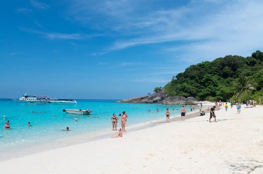 SIMILANS ISLANDS, THAILAND - MARCH 18, 2014: Tourists relax on idyllic tropical beach Ko Miang island, Mu Ko Similan National Park 