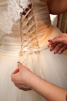 back of a wedding dress with artificial flowers