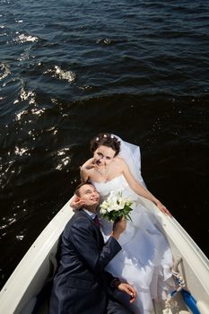 happy young couple on the yacht