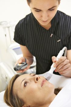 Beautician Carrying Out Ultrasound Skin Rejuvenation Treatment